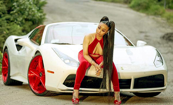 Image of Blac Chyna with her car Ferrari 488 spider